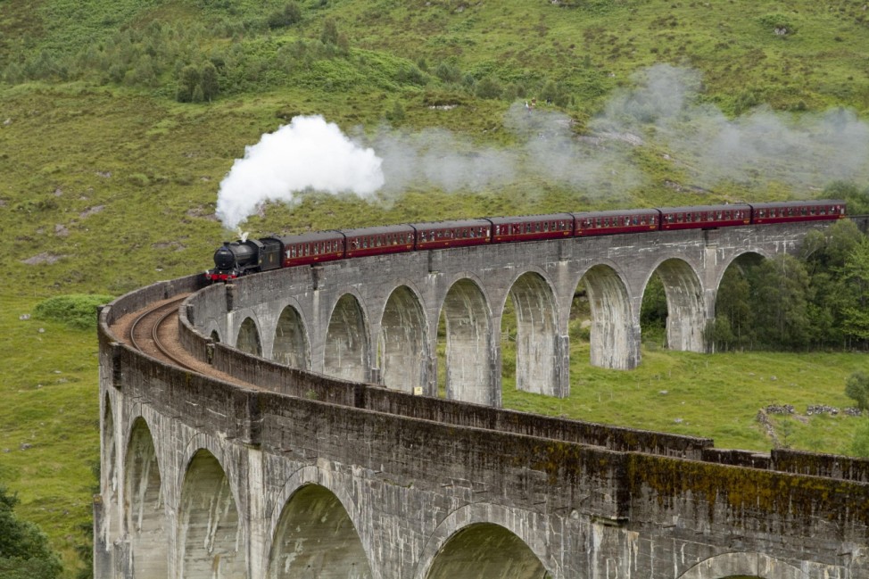 The Jacobite steam train passing over the Glenfinnan Viaduct at the head of Loch Shiel, Lochaber, Highlands of Scotland
