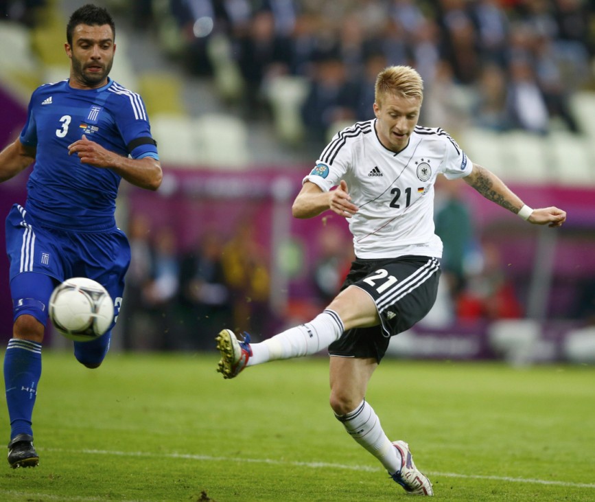 Germany's Marco Reus kicks the ball in front of Greece's Giorgos Tzavellas during their quarter-final soccer match at the PGE Arena in Gdansk