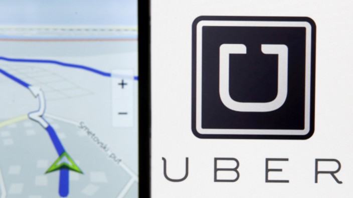 Photo illustration of Nokia Maps on a smartphone in front of a displayed logo of Uber in Zenica