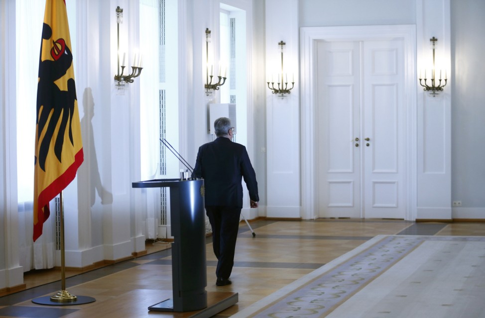 German President Gauck leaves after a statement at the presidential residence Bellevue Palace in Berlin