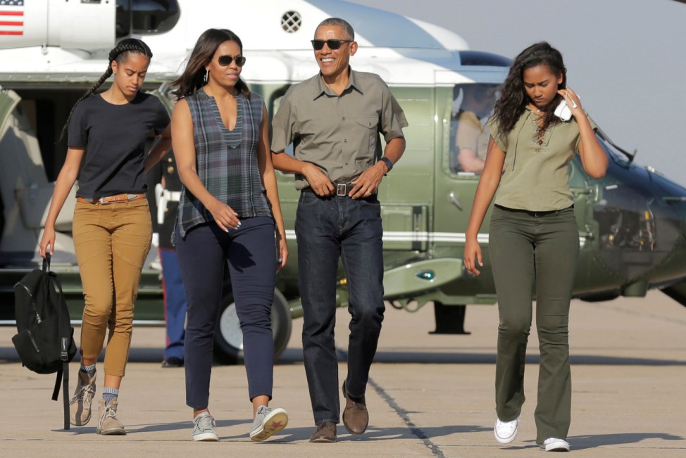 U.S. President Barack Obama and U.S. First Lady Michelle Obama and their daughters Malia and Sasha walk to Air Force One as they depart from Roswell, New Mexico
