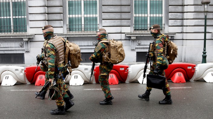 Belgian soldiers take positions outside a meeting of the government's security council in Brussels