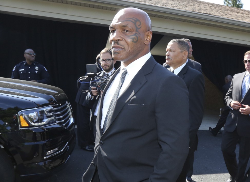 Pallbearer Mike Tyson leaves the funeral home to attend Muhammad Ali's memorial in Louisville