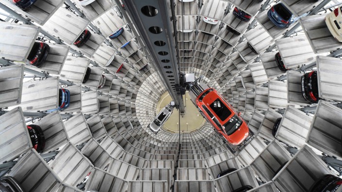 A VW Golf VII car and a VW Passat are loaded  in a delivery tower at the plant of German carmaker Volkswagen in Wolfsburg