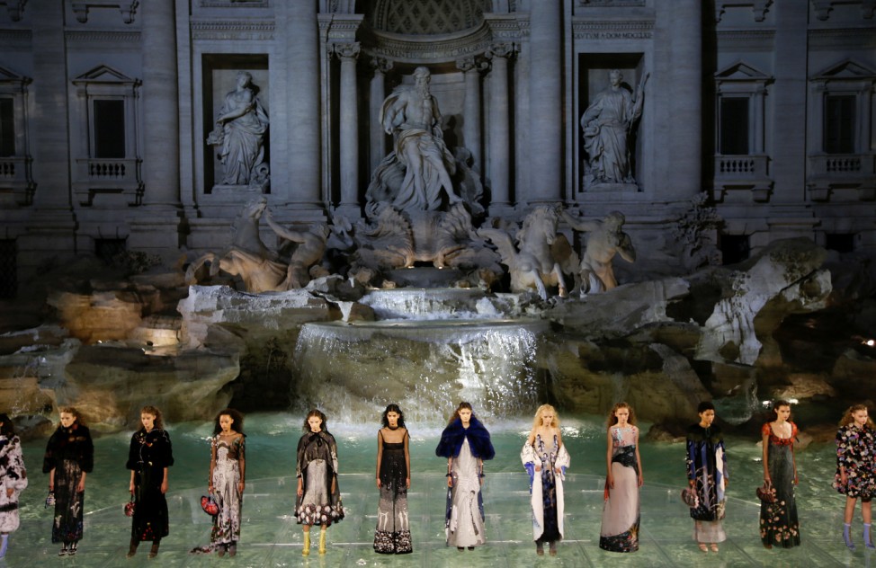 Models present creations to celebrate the 90th anniversary of Fendi Fashion house during a show in Rome