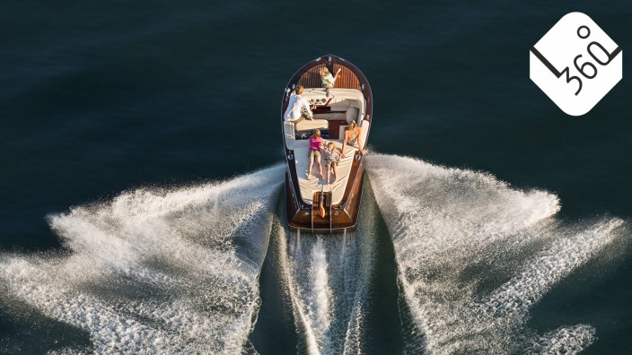 Germany Baden Wurttenberg Lake Constance Family on wooden motorboat model released property relea