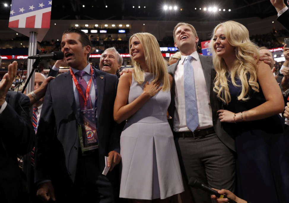 Donald Trump's children celebrate after announcing the votes to put their father over the top to win the Republican presidential nomination during the second day of the Republican National Convention in Cleveland