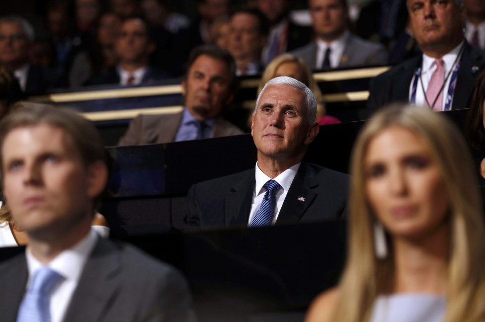 Republican U.S. vice presidential nominee Mike Pence (C) is seen between the children of Donald Trump, son Eric (L) and daughter Ivanka, at the Republican National Convention in Cleveland