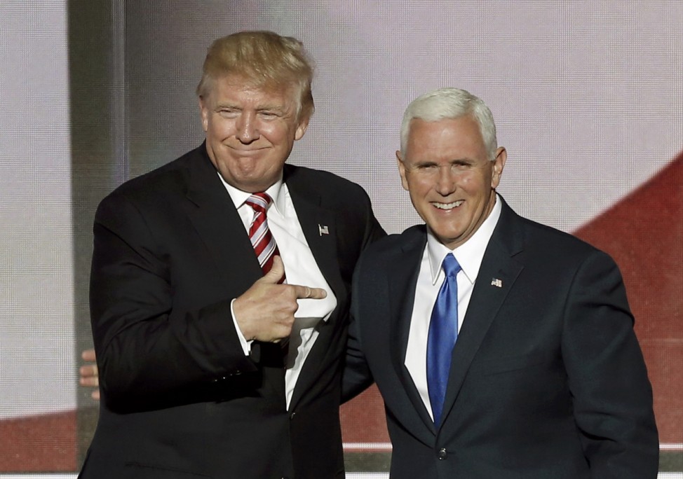 Republican U.S. presidential nominee Donald Trump greets vice presidential nominee Mike Pence after Pence spoke at the Republican National Convention in Cleveland