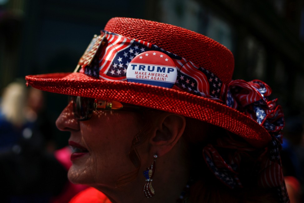 A woman wears a hat with a pin in support of Donald Trump near the site of the Republican National Convention in Cleveland, Ohio