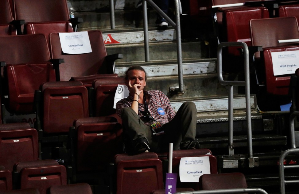 A supporter of former Democratic U.S. presidential candidate Sanders sits alone at the Democratic National Convention in Philadelphia, Pennsylvania