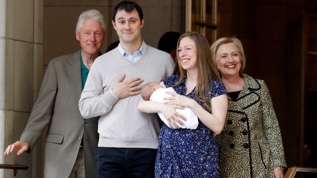 Chelsea Clinton holds her newborn son Aidan Clinton Mezvinsky  with her husband Marc Mezvinsky,  as U.S. Democratic presidential candidate Hillary Clinton and former President Bill Clinton pose together as they exit Lenox Hill Hospital in New York