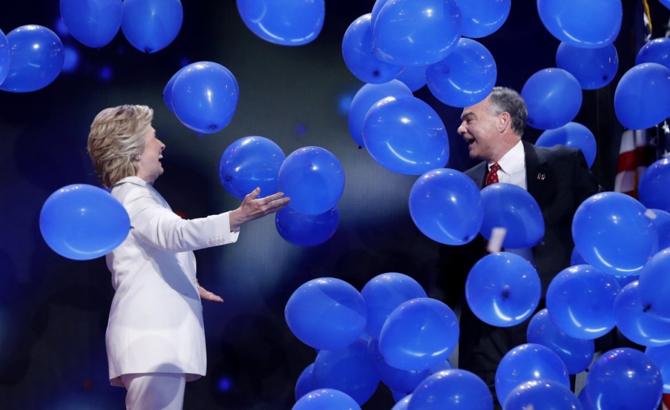 Democratic presidential nominee Clinton celebrates among balloons with her vice presidential running mate Kaine after accepting the nomination on the fourth and final night at the Democratic National Convention in Philadelphia