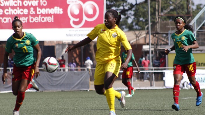Zimbabwe senior national women soccer team player Rudo Neshamba C vies for the ball during the sec; Rudo Neshamba