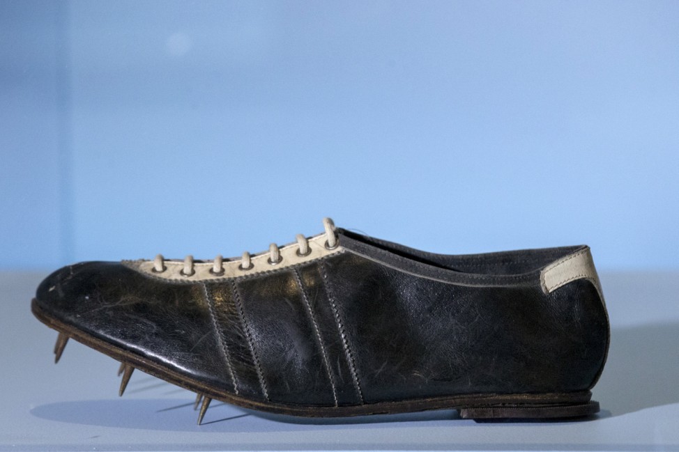 File photo of a running shoe that Dassler gave to the Olympic medal winner Owens displayed at the Brooklyn Museum in the Brooklyn borough of New York