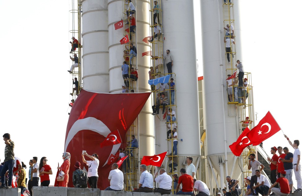 People wave Turkey's national flags during the Democracy and Martyrs Rally in Istanbul