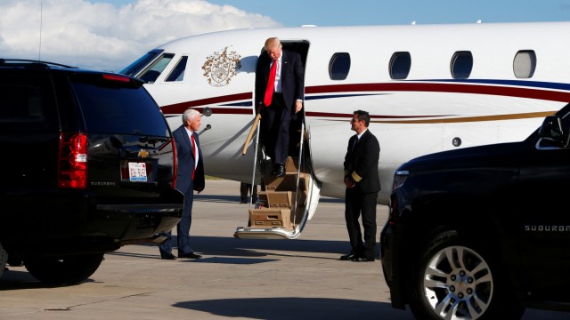 Republican U.S. Presidential nominee Donald Trump and his running mate vice presidential candidate Mike Pence arrive at the airport in Green Bay, Wisconsin