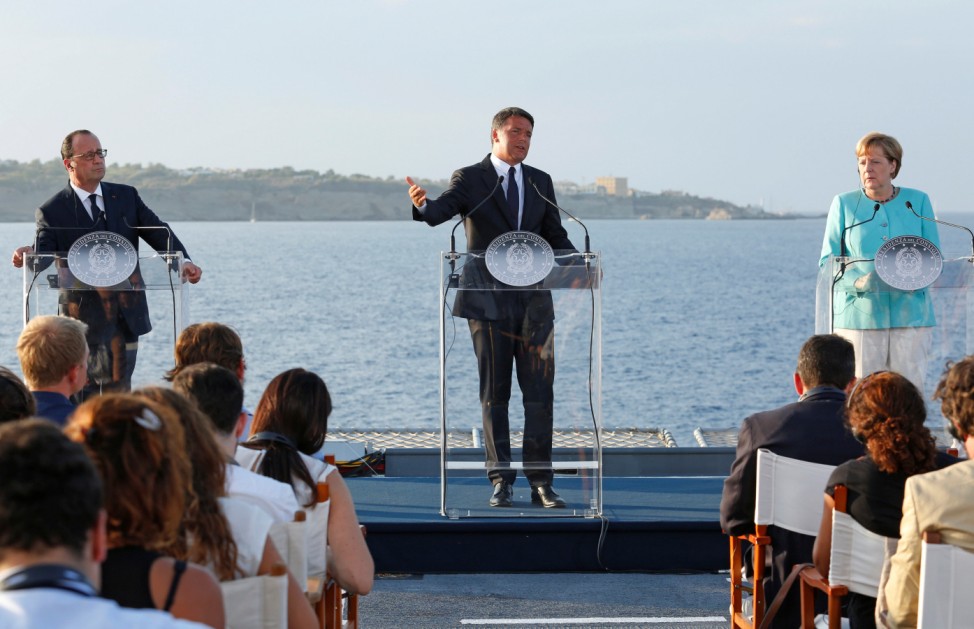 Italian Prime Minister Renzi, German Chancellor Merkel and French President Hollande lead a news conference on the Italian aircraft carrier Garibaldi off the coast of Ventotene island