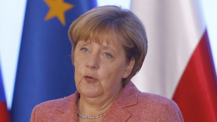 German Chancellor Merkel speaks during the news conference in Warsaw