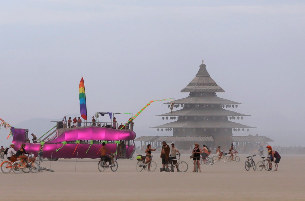 An art car and the Temple Project are visible on the Playa as approximately 70,000 people from all over the world gather for the 30th annual Burning Man arts and music festival in the Black Rock Desert of Nevada