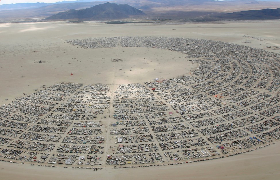 An aerial view as approximately 70,000 people from all over the world gather for the 30th annual Burning Man arts and music festival in the Black Rock Desert of Nevada, U.S.