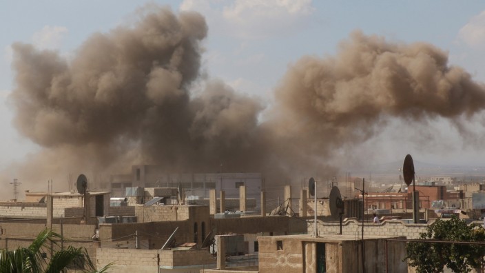Smoke rises after an airstrike in the rebel-held town of Dael, in Deraa Governorate