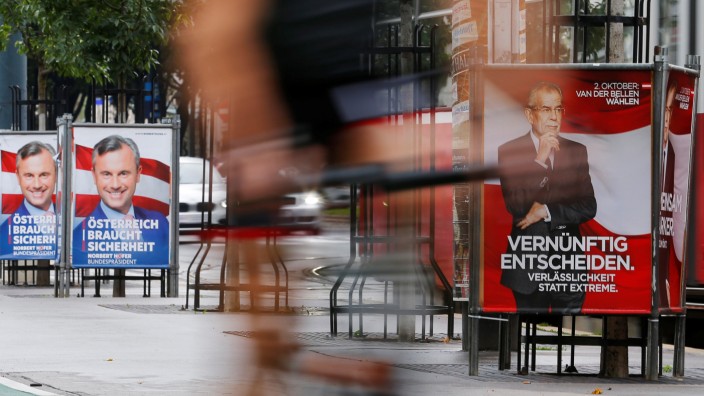 Presidential election campaign posters of Norbert Hofer and Alexander Van der Bellen are seen in Vienna