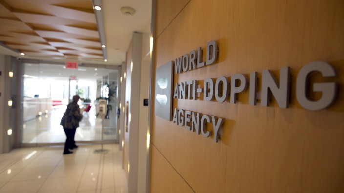 A woman walks into the head offices of WADA in Montreal