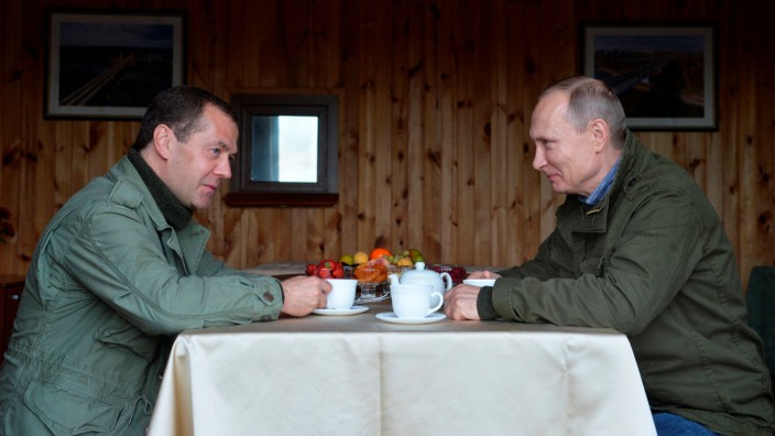 Russian President Putin and Prime Minister Medvedev are seen during their meeting on Lipno Island in Novgorod region, Russia