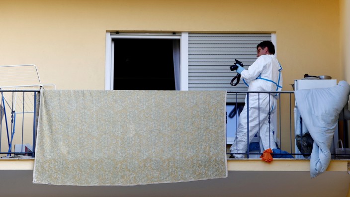 Police photographes a flat where the 27-year-old Syrian suspect lived, after an explosion in Ansbach near Nuremberg