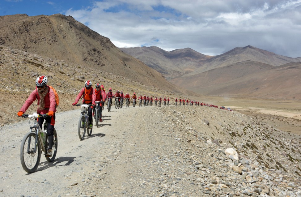 Buddhist nuns from the Drukpa lineage pictured in Ladakh during their cycle across the Himalayas
