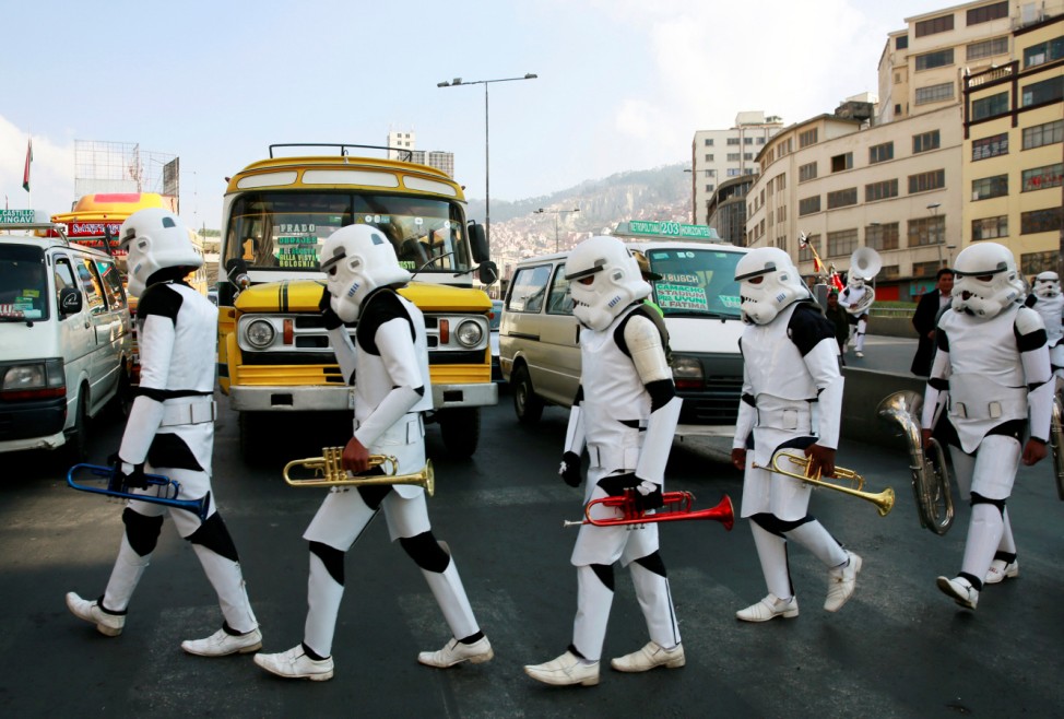 Members of a school band wearing Star Wars costumes walk in the center of La Paz