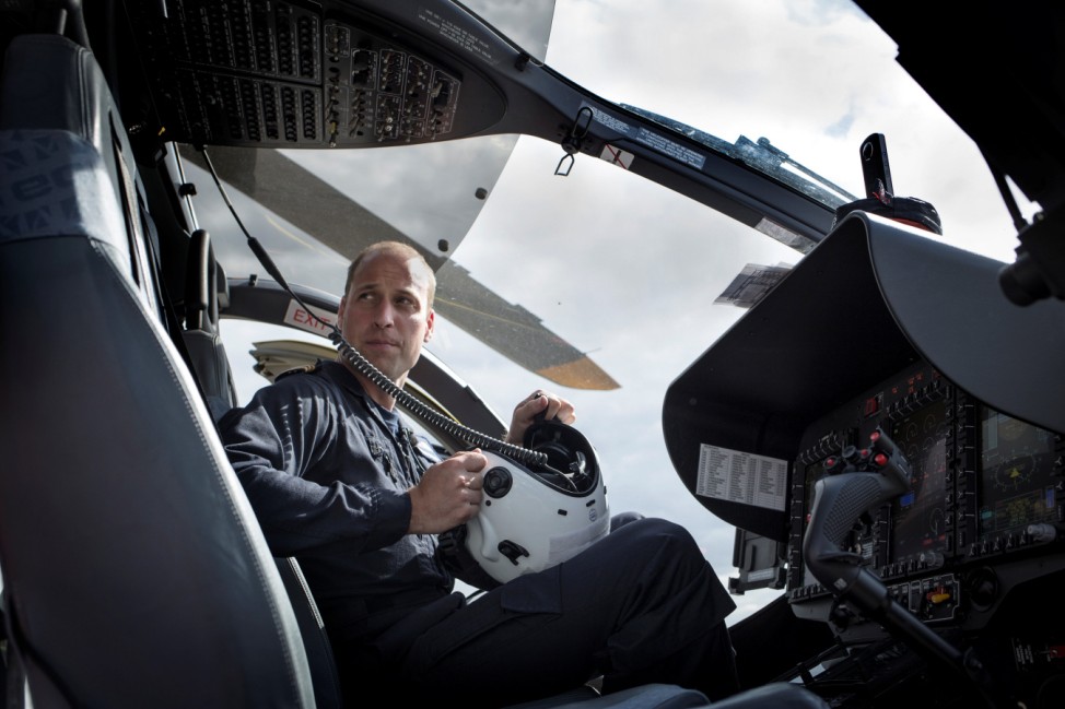 Britain's Prince William sits in the cockpit of his East Anglian Air Ambulance H145 helicopter in this photograph released in London