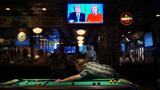 Patrons at McGregor's Bar and Grill watch the first televised debate between Democratic presidential candidate Hillary Clinton and Republican presidential candidate Donald Trump in San Diego