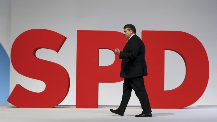 German Economy Minister and Leader of the SPD Sigmar Gabriel walks on the podium during party congress in Berlin