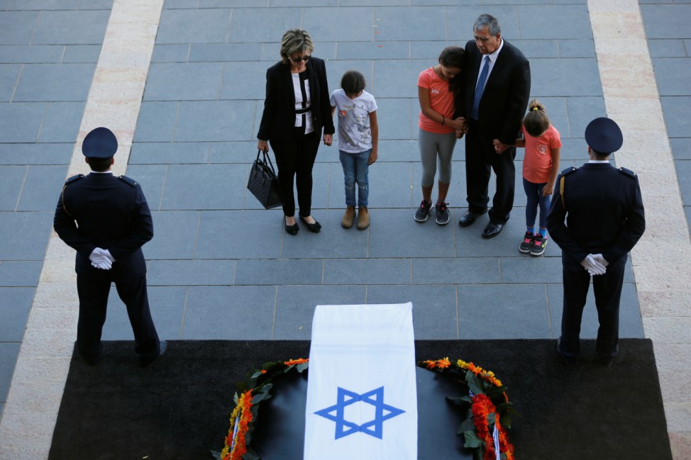 Former Israeli member of parliament Micky Levy in front of the flag-draped coffin of former Israeli President Shimon Peres, as he lies in state at the Knesset plaza, the Israeli parliament, in Jerusalem