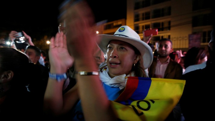 Supporters of 'No' vote celebrate after the nation voted 'No' in a referendum on a peace deal between the government and FARC rebels, in Bogota, Colombia