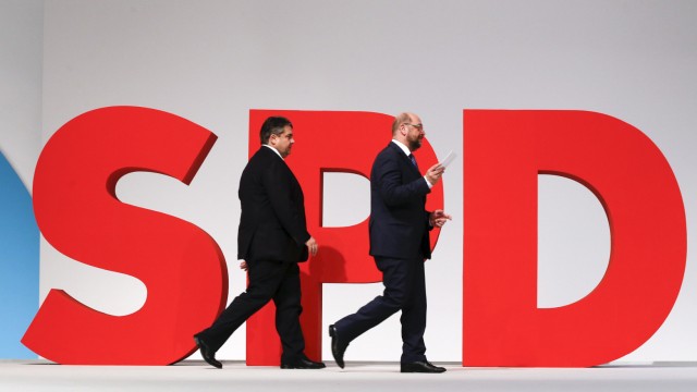 Leader of the SPD Gabriel and European Parliament President Schulz walks on the podium during party congress in Berlin