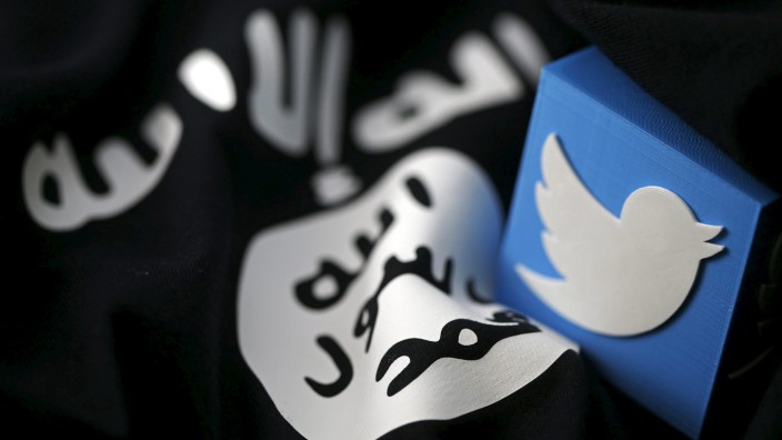 An illustration picture of a 3D printed logo of Twitter and an Islamic State flag