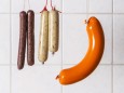 Vegan and vegetarian sausages hanging on hooks property released PUBLICATIONxINxGERxSUIxAUTxHUNxONLY