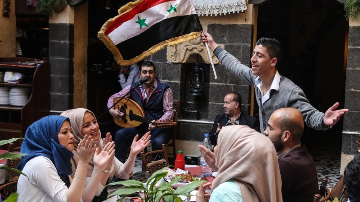 DAMASCUS SYRIA APRIL 2 2016 People in a restaurant in the Syrian capital Damascus Valery Shari