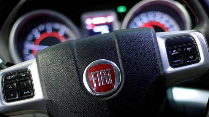 The Fiat logo is seen on the steering wheel of a Fiat 'Freemont' model at a mechanic's workshop in Rome