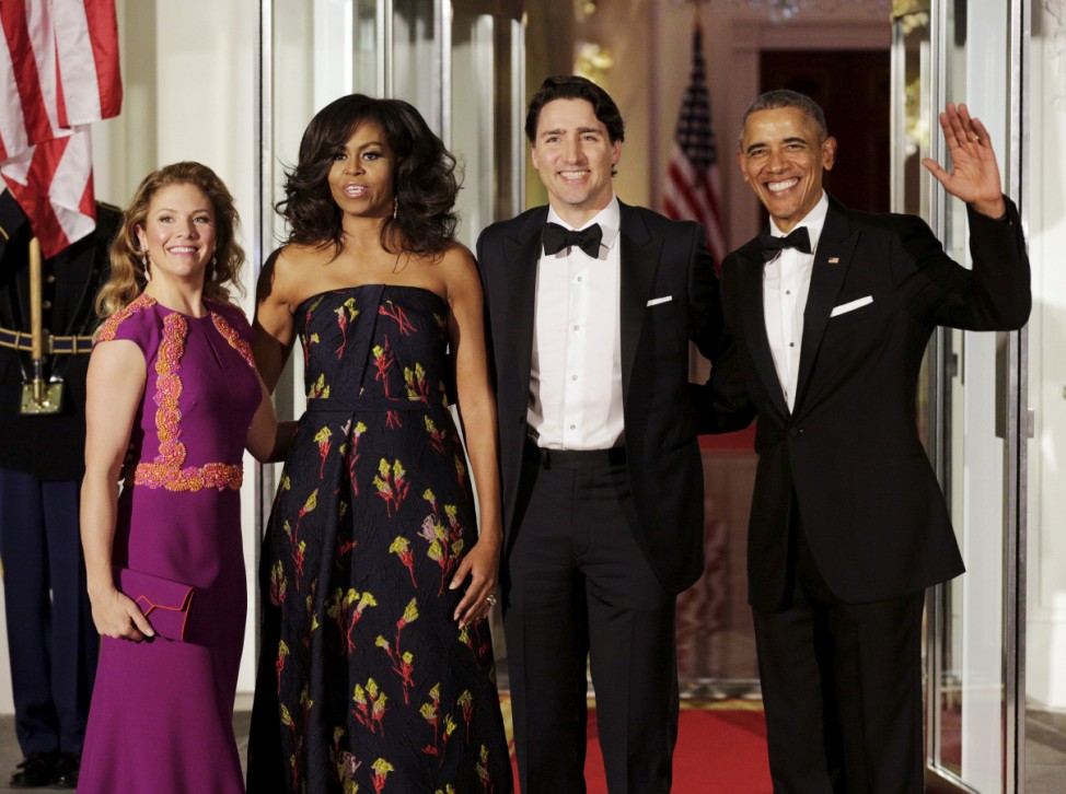 U.S. President Barack Obama and first lady Michelle Obama welcome Canada's PM Justin Trudeau and his wife Sophie Gregoire-Trudeau as they arrive for a state dinner at the White House in Washington