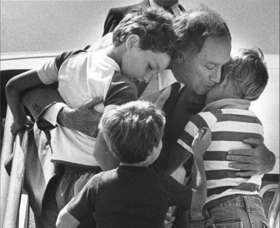 File photo of Canada's Prime Minister Pierre Trudeau greeting his sons Justin, Sacha and Michel after returning home from a foreign trip in Ottawa