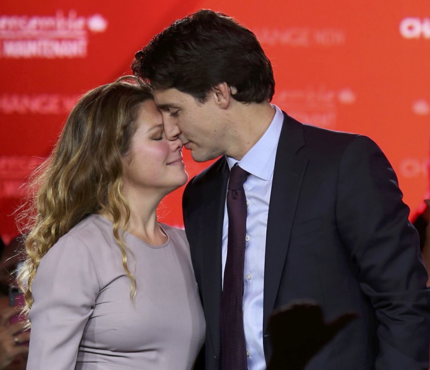 Liberal Party leader Justin Trudeau shares a moment with his wife Sophie Gregoire as he gives his victory speech after Canada's federal election in Montreal