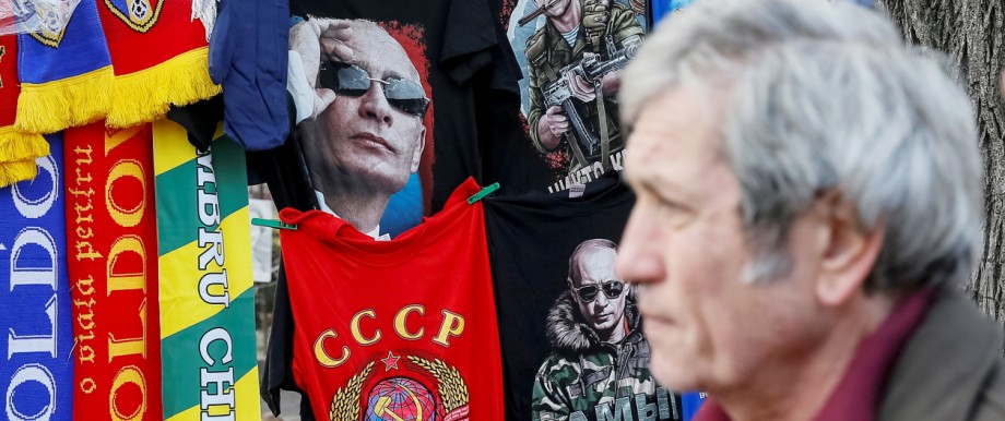T-shirts depicting images of Russia's President Vladimir Putin and former USSR coat of arms are on sale at the street in central Chisinau