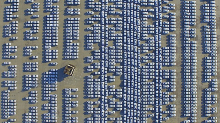 File photo of an aerial view showing new Audi cars in an open-air parking lot in Changchun