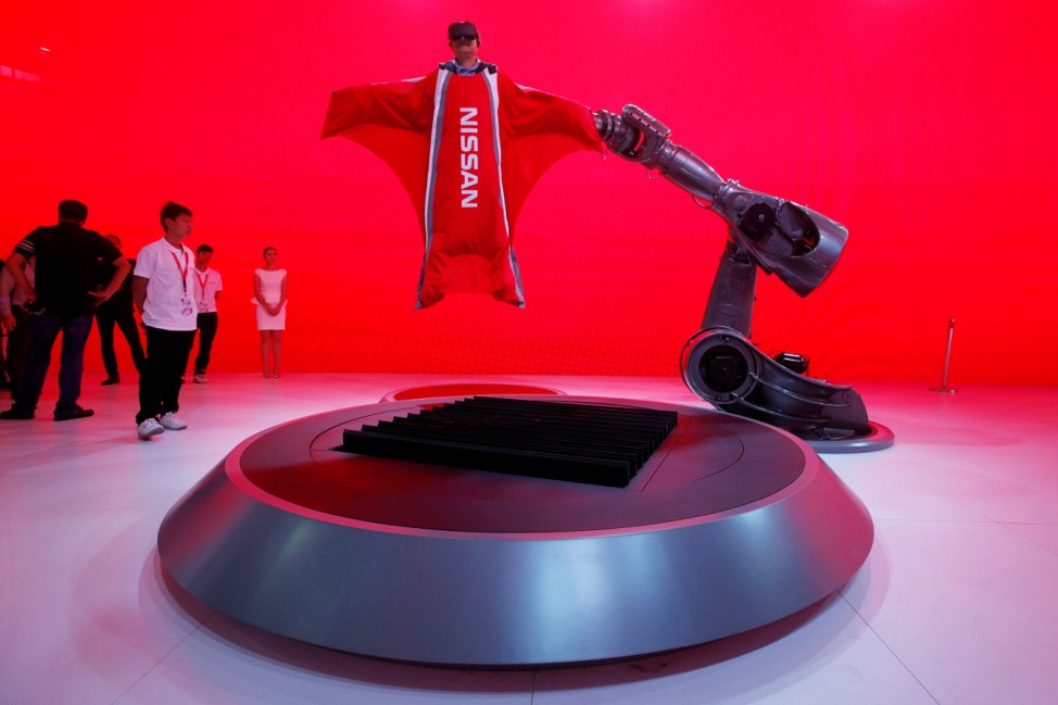 A visitor tries a Nissan VR experience at China (Guangzhou) International Automobile Exhibition in Guangzhou