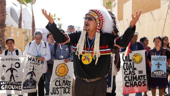 Representatives of different indigenous groups from various countries protest during the UN Climate Change Conference 2016 (COP22) in Marrakech