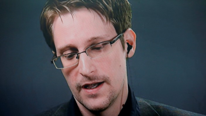 Edward Snowden speaks via video link during a news conference in New York City